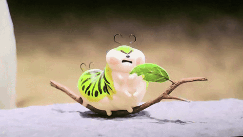 A Cartoon Worm With A Green Leaf On Its Back Is Sitting On A Branch GIF
