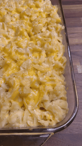 A Casserole Dish Filled With Macaroni And Cheese GIF