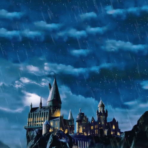 a castle on top of a hill with a blue sky and rain