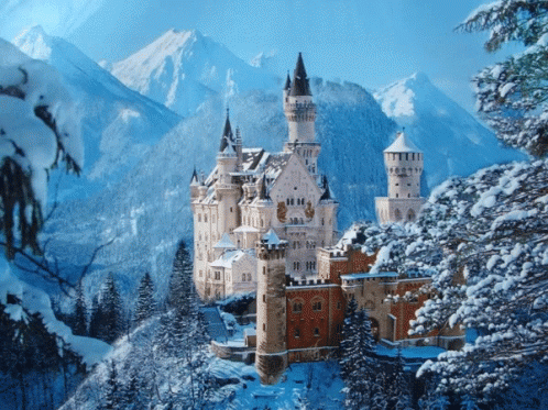 A Castle Surrounded By Snow Covered Trees And Mountains In The Background GIF
