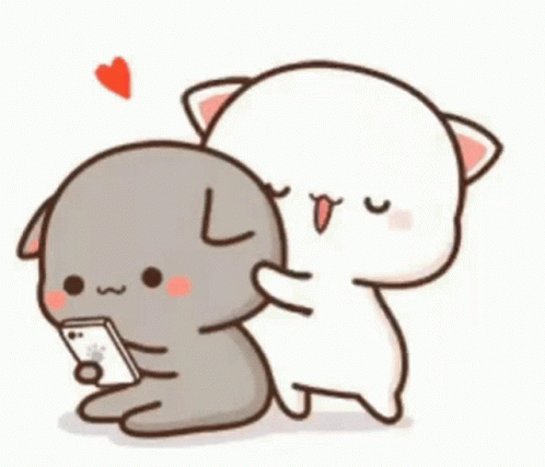 A Cat And A Dog Are Hugging Each Other While The Cat Is Looking At A Cell Phone . GIF