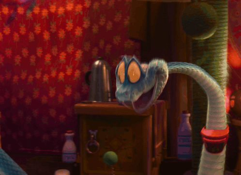 A Cat And A Snake Standing Next To Each Other GIF