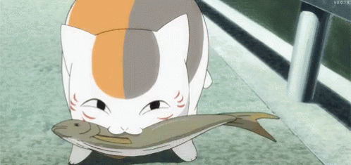 A Cat Is Holding A Large Fish In Its Mouth GIF