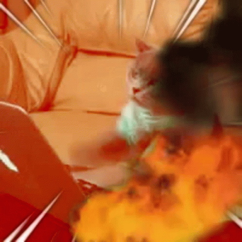 A Cat Is Laying On A Couch With A Fireball In The Background . GIF
