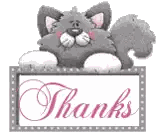 a cat is sitting on a sign that says thanks .