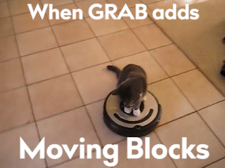 A Cat Is Sitting On Top Of A Robotic Vacuum Cleaner GIF