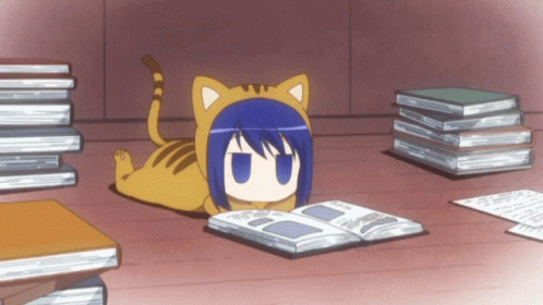 A Cat Laying On The Floor Reading A Book Next To A Pile Of Books GIF