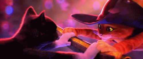 A Cat Wearing A Cowboy Hat Is Playing With Another Cat GIF