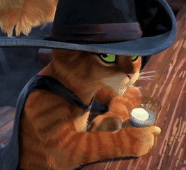 A Cat Wearing A Hat And A Cape Is Holding A Glass Of Milk GIF