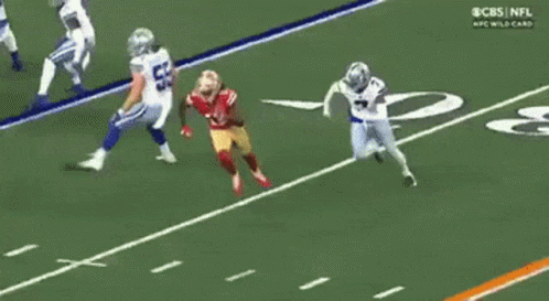 A Cbs Nfl Wild Card Game Is Being Played On A Football Field GIF