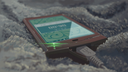 A Cell Phone Is Plugged Into A Charger And The Time Is 00:00 GIF