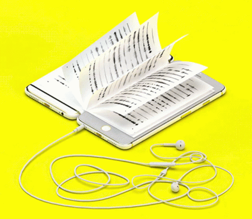 A Cell Phone Is Plugged Into An Open Book GIF
