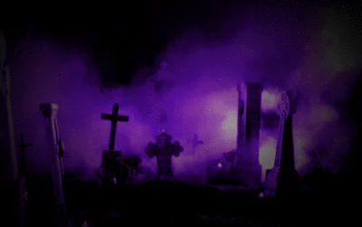 A Cemetery With A Purple Light Behind It GIF