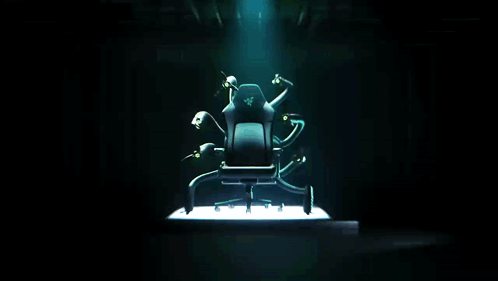 A Chair With A Razer Logo On It Is Surrounded By Monsters GIF