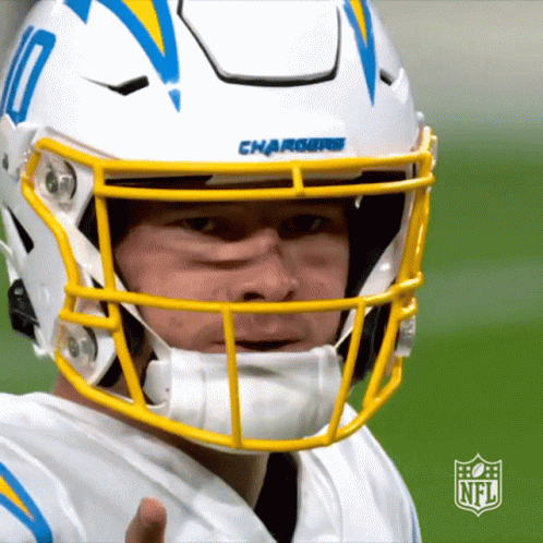A Chargers Football Player Wearing A White Helmet GIF