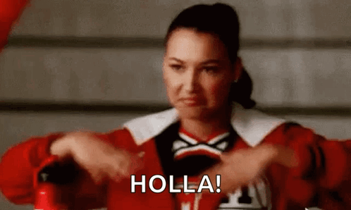 A Cheerleader Is Holding A Fire Extinguisher And Making A Face . GIF