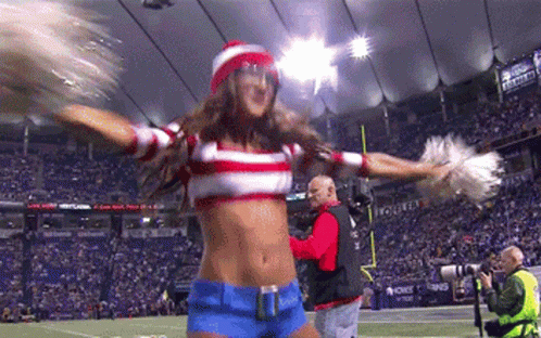 A Cheerleader Is Wearing A Red White And Blue Striped Shirt And A Red Hat GIF