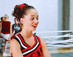 A Cheerleader Wearing A Red Black And White Uniform With The Letter Ch On The Front GIF