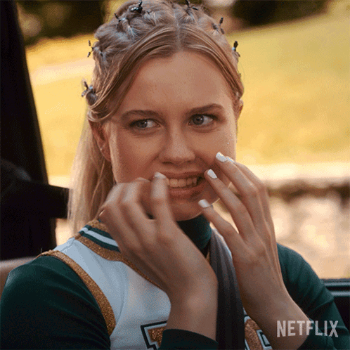 A Cheerleader With Netflix Written On The Bottom Right GIF