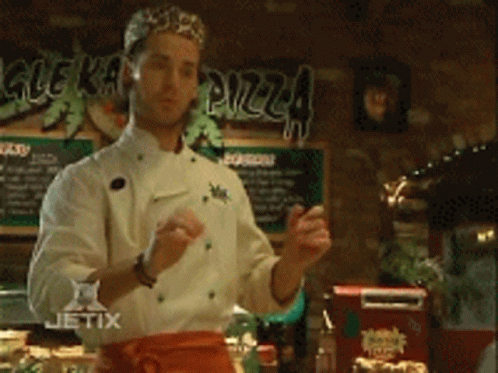 A Chef In Front Of A Sign That Says Glekarma GIF
