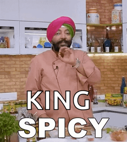 A Chef With A Turban On Says King Spicy In A Kitchen . GIF