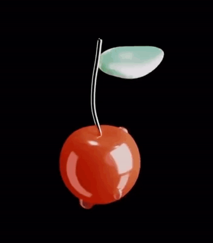 A Cherry With A Green Leaf On A Black Background . GIF