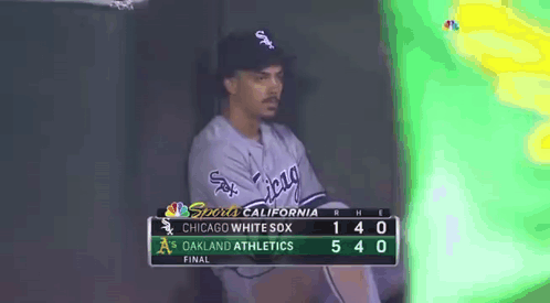 A Chicago White Sox Baseball Player Sits In The Dugout During A Game Against The Oakland Athletics GIF