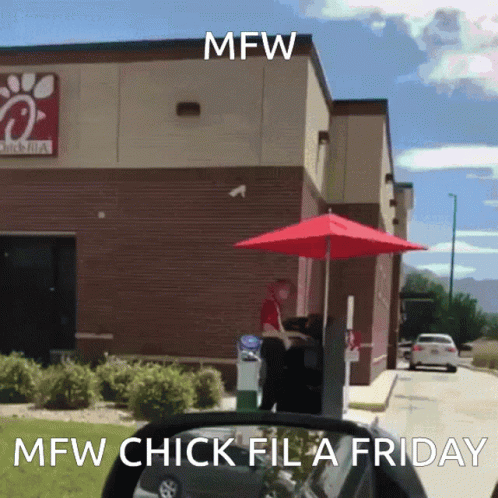 A Chick-Fil-A Drive-Thru With A Red Umbrella In Front Of It GIF