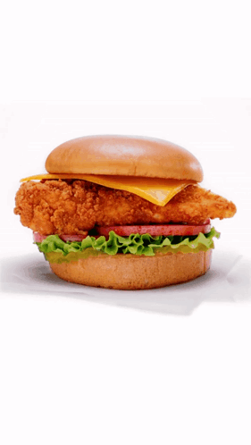 A Chicken Sandwich With Lettuce Tomato And Cheese GIF