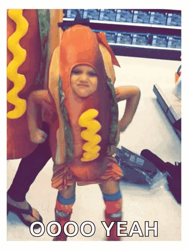 A Child Dressed As A Hot Dog With The Words Oooo Yeah Below Him GIF