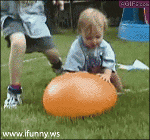 A Child Is Playing With An Orange Ball And The Website Www.ifunny.ws Is Visible In The Corner GIF
