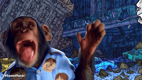 A Chimpanzee Wearing A Blue Shirt With Faces On It Stands In Front Of A Building That Says Radio GIF
