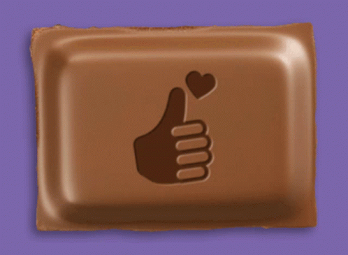 A Chocolate Bar With A Thumbs Up Sign And A Heart On It GIF