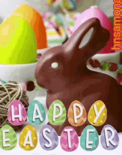 A Chocolate Bunny Is Surrounded By Colorful Easter Eggs And The Words Happy Easter Written On Them GIF