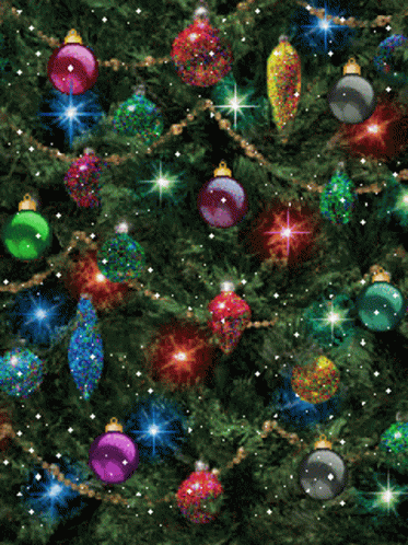 A Christmas Tree Is Decorated With Lots Of Colorful Ornaments GIF