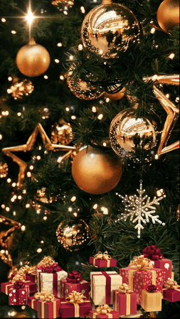 A Christmas Tree With Gifts Underneath It And Gold Ornaments GIF