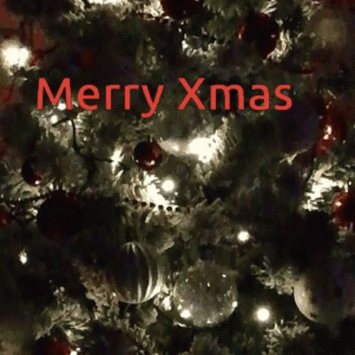 A Christmas Tree With The Words Merry Xmas Written In Red GIF