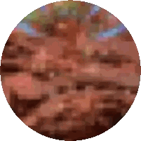 a circle with a blurred image of a brick wall in the background