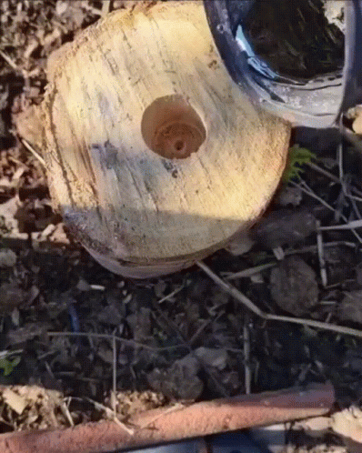 A Circular Piece Of Wood With A Hole In The Middle GIF