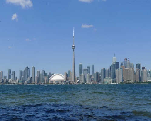 A City Skyline With The Cn Tower In The Middle GIF