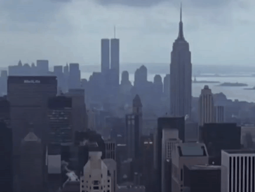 A City Skyline With The Empire State Building In The Background GIF