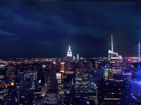 a city skyline with the empire state building visible