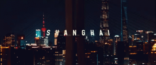 A City Skyline With The Word Shanghai In White Letters GIF