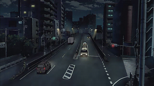 A City Street At Night With Cars Driving Down It And A Sign That Says ' Tokyo ' On It GIF