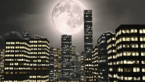 A Cityscape With A Full Moon In The Sky GIF