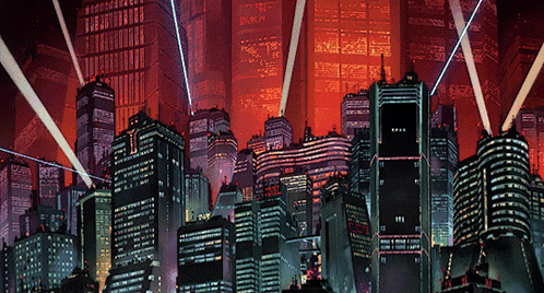 A Cityscape With A Lot Of Buildings And A Few Lights Coming Out Of Them GIF