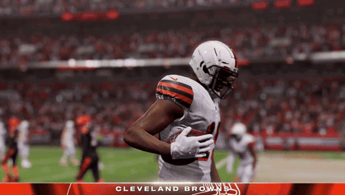 a cleveland browns player is running with the ball