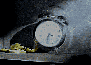 A Clock With A Face On It Shows That It Is Almost 5:00 GIF