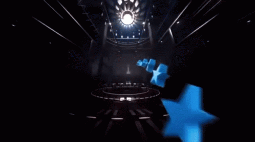 A Clock With A Red Cape And A Blue Ball On Top Of It GIF