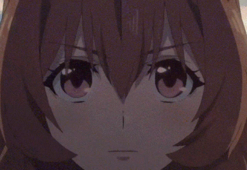 A Close Up Of A Anime Character 'S Face With A Blurred Background GIF